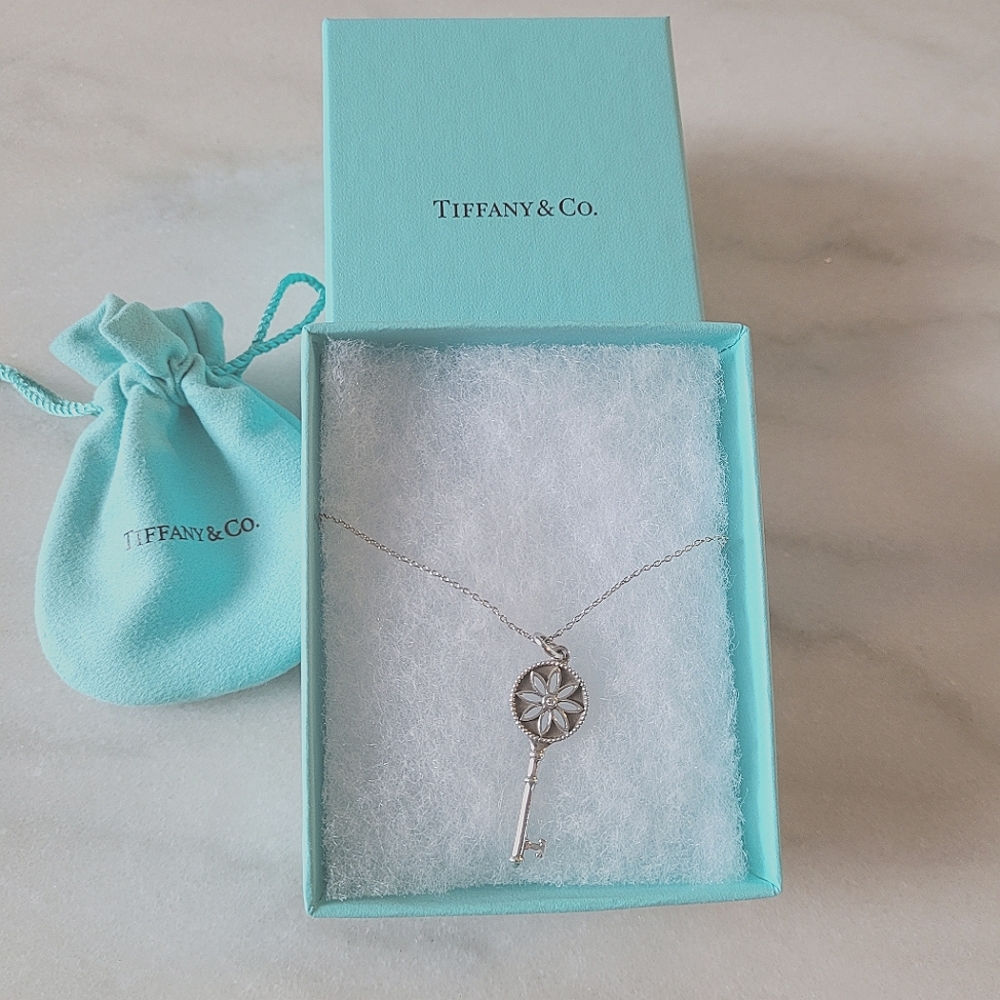 SOLD ON EBAY Tiffany & Co diamond daisy key pendant
